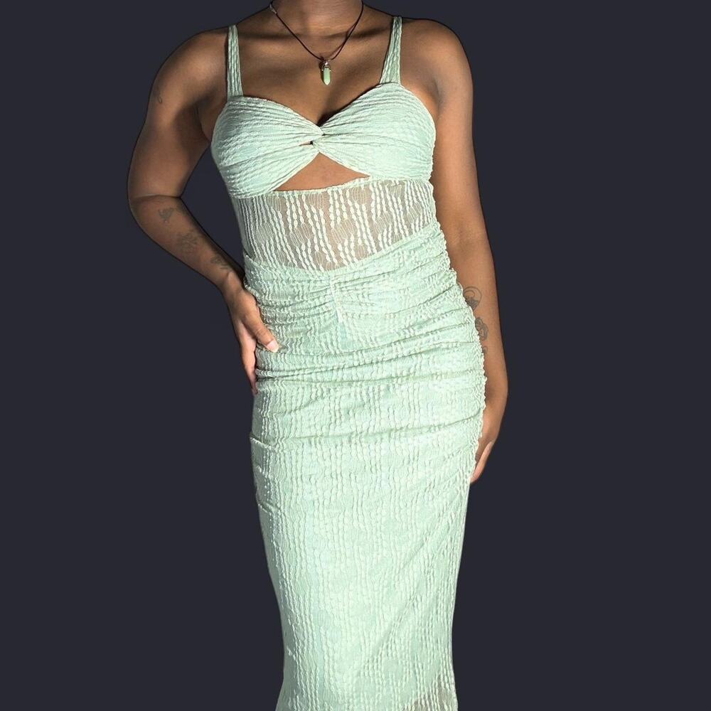 Green midi dress with lace sheer detail.